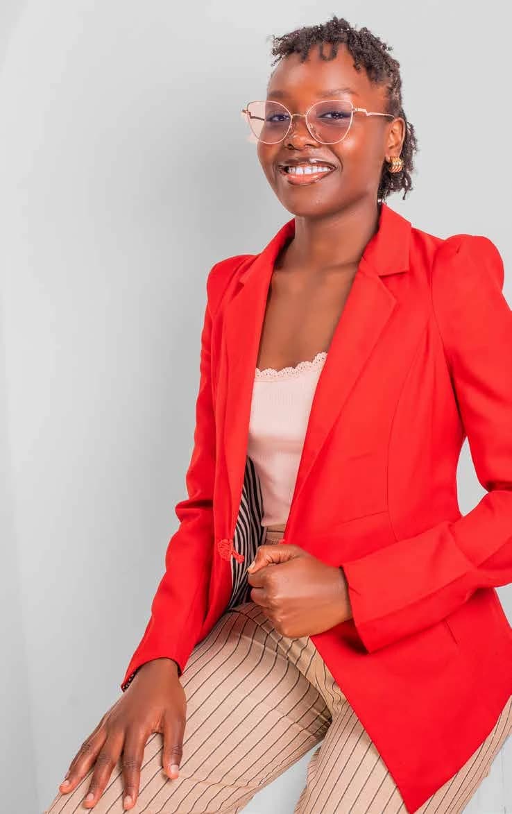 Blessing Amusolo wearing a red blazer